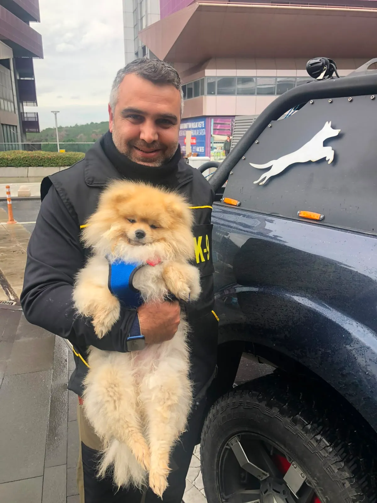 A boy hugging his dog at PatiLee